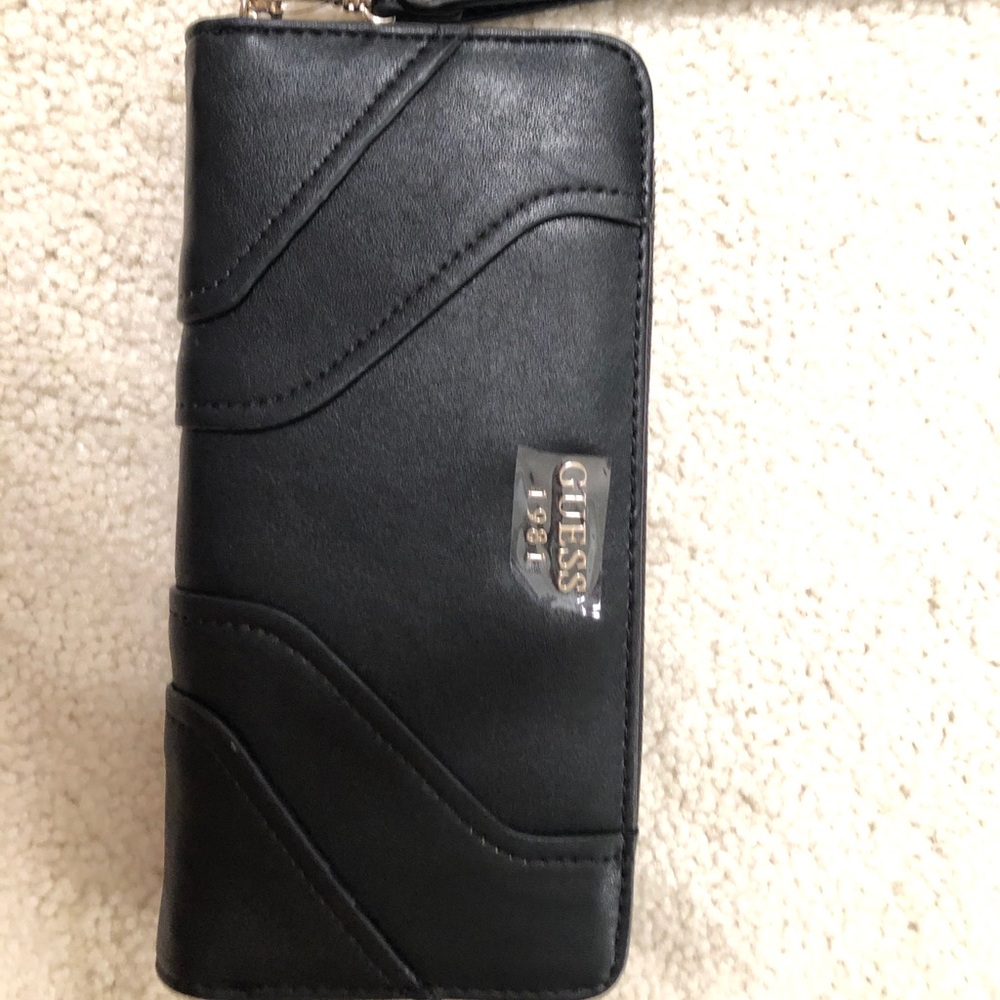 Authentic Guess Black leather clutch / wristlet